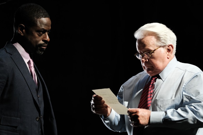 Leo McGarry, Chief of Staff, and President Bartlet gather to discuss an important document. Bartlet is played by Martin Sheen, and Sterling K. Brown is filling in for John Spencer who originally played Leo, but unfortunately passed away before the special was filmed. Photo courtesy of Los Angeles Times.