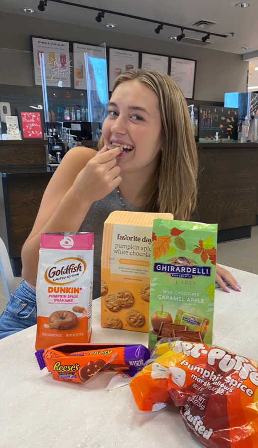 Peyton Anderson photographed by Amanda Fronczack eating pumpkin spice products.